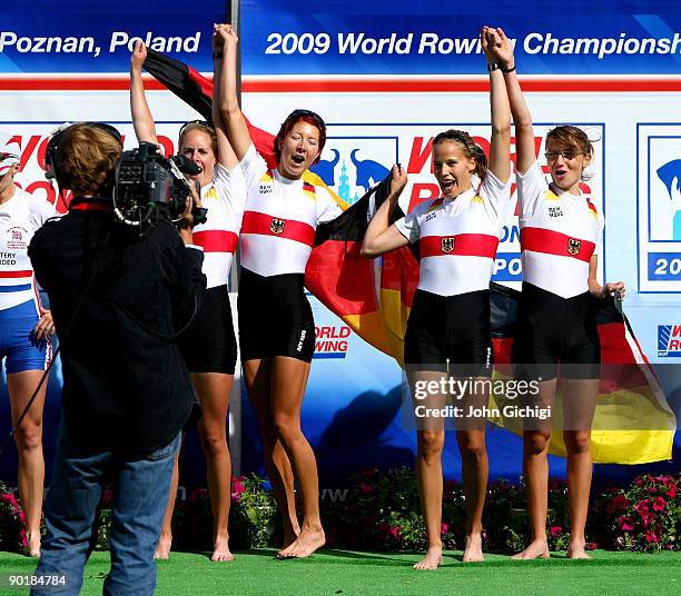 Julia Kroeger, Laura Tibitanzl, Helke Nieschlag and Lena Mueller of Germany celebrate winning the Women's Lightweight Quadruple Sculls during the...