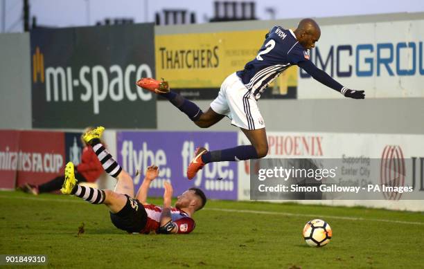 Exeter City's Jake Taylor and West Bromwich Albion's Allan Nyom battle for the ball during the FA Cup, third round match at St James' Park, Exeter.