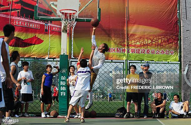 Canadian basketball star Steve Nash plays a pickup game of basketball at the Dongdan courts in central Beijing on August 30, 2009. Nash, a two-time...