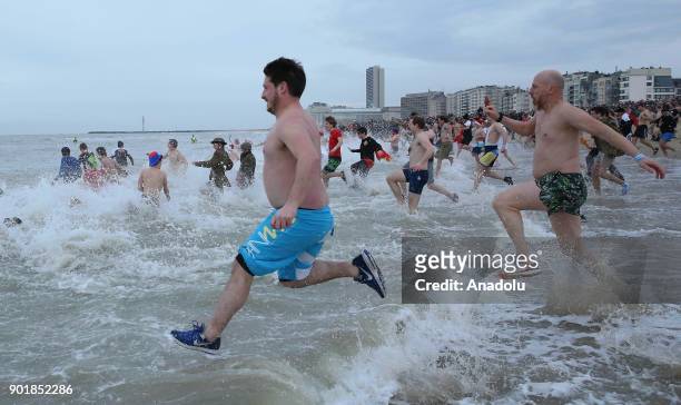Participants are seen in the water during a polar bear plunge on a cold day in Oostende, Belgium on January 06, 2018. Approximately 5000...