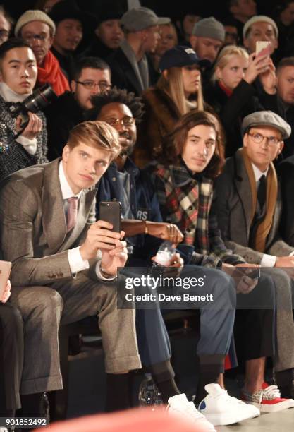 Toby Huntington-Whiteley, Jesiah Sampson, Hector Bellerin and Ollie Proudlock sit in the front row at the Oliver Spencer LFWM AW18 Catwalk Show at...