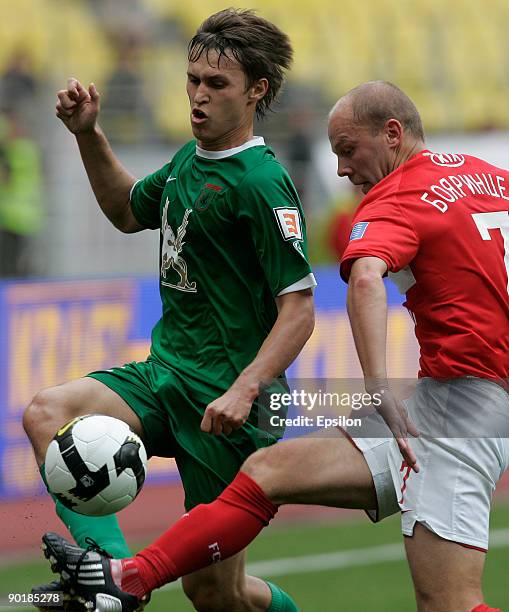 Denis Boyarintcev of FC Spartak Moscow battles for the ball with Alexandr Ryazantsev of FC Rubin Krazan during the Russian Football League...