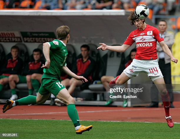 Pavel Yakovlev of FC Spartak Moscow battles for the ball with Vitali Kaleshin of FC Rubin Krazan during the Russian Football League Championship...