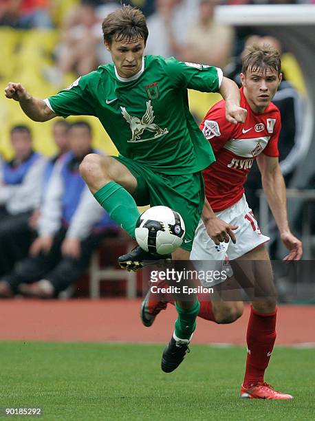 Sergey Parshivlyuk of FC Spartak Moscow battles for the ball with Alexandr Ryazantsev of FC Rubin Krazan during the Russian Football League...