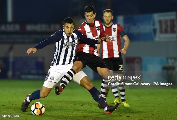 West Bromwich Albion's Jake Livermore and Exeter City's Lloyd James battle for the ball during the FA Cup, third round match at St James' Park,...