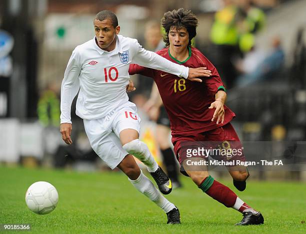 Ravel Morrison of England is challenged by Joao Carlos of Portugal during the international match between England U17 and Portugal U17 at Meadow Lane...