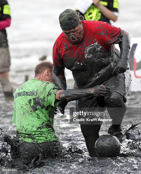 Participants play football during the Mudflat Olympic Games on August 30, 2009 in Brunsbuttel, Germany.