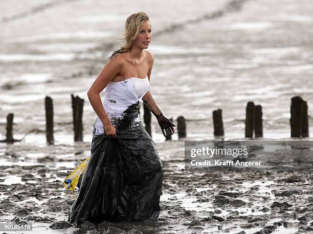 Participants of the fashion show are seen during the Mudflat Olympic Games on August 30, 2009 in Brunsbuttel, Germany.