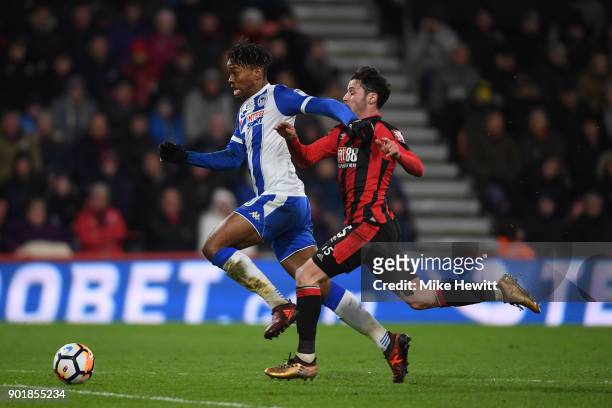Ivan Toney of Wigan is challenged by Adam Smith of Bournemouth during The Emirates FA Cup Third Round match between AFC Bournemouth and Wigan...