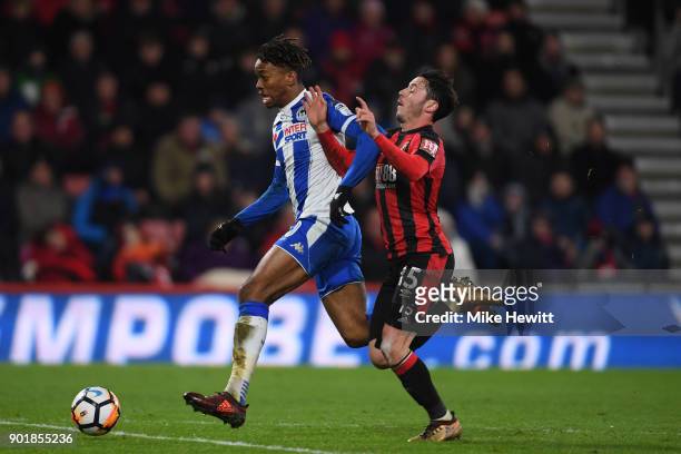 Ivan Toney of Wigan is challenged by Adam Smith of Bournemouth during The Emirates FA Cup Third Round match between AFC Bournemouth and Wigan...