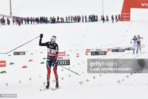 Winner Norway's Heidi Weng , crosses the finnish line to win the Women's Cross Country 10 km Mass Start Classic race of the FIS World cup Tour de Ski...