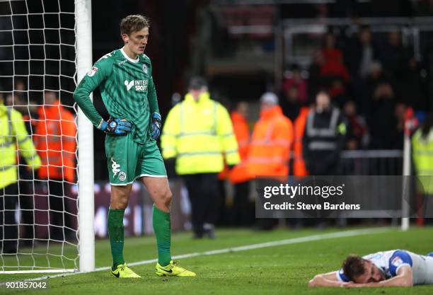 Christian Walton of Wigan Athletic reacts after AFC Bournemouth score their second goal during The Emirates FA Cup Third Round match between AFC...