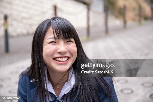 Highs school girl making full of smile Highs school girl making full of smile