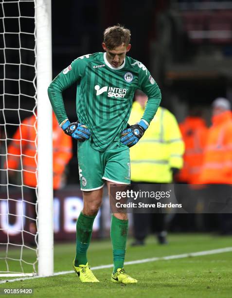 Christian Walton of Wigan Athletic looks dejected after AFC Bournemouth score their second goal during The Emirates FA Cup Third Round match between...