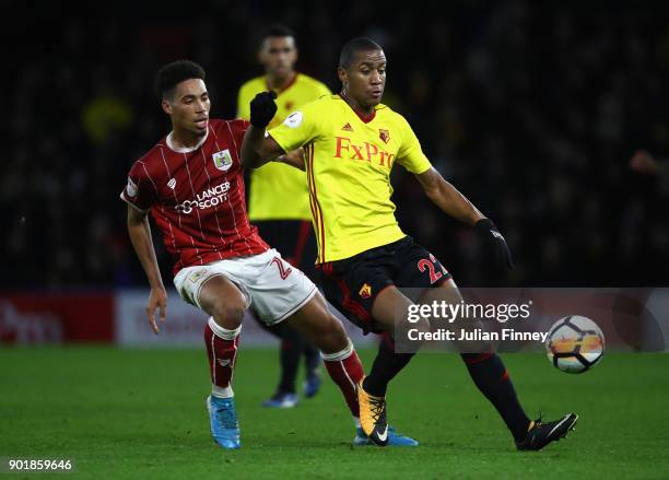 Zak Vyner of Bristol City battles with Marvin Zeegelaar of Watford during The Emirates FA Cup Third Round match between Watford and Bristol City at...