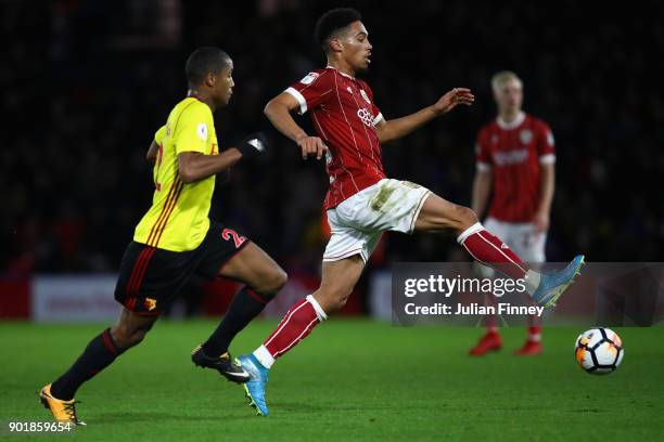 Zak Vyner of Bristol City battles with Marvin Zeegelaar of Watford during The Emirates FA Cup Third Round match between Watford and Bristol City at...