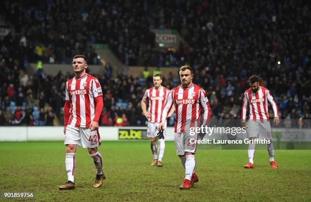 Thomas Edwards and Xherdan Shaqiri of Stoke City leave the field dejected after The Emirates FA Cup Third Round match between Coventry City and Stoke...