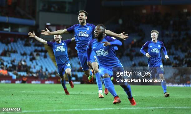 Ryan Tafazolli celebrates after scoring the second goal with Junior Morias during the The Emirates FA Cup Third Round match between Aston Villa and...