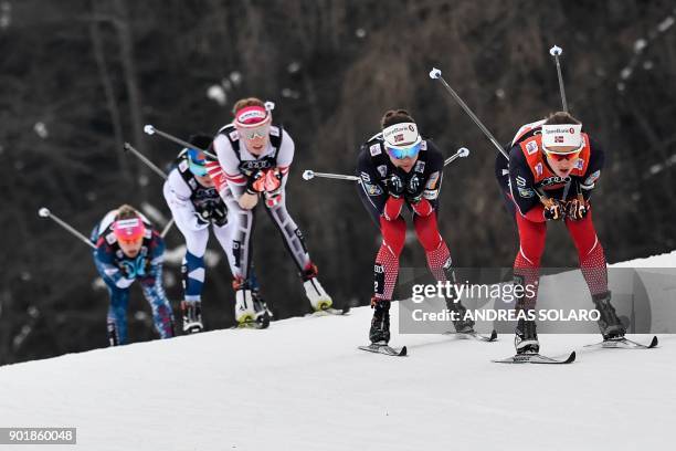 Norway's Ingvild Flugstad Oestberg, her compatriot Norway's Heidi Weng, Austria's Teresa Stadlober and Finland's Krista Parmakoski, compete on...