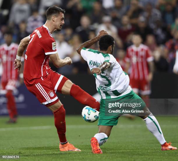 Sandro Wagner of Muenchen is challenged by Khalil Shreff of Al Ahli during the friendly match between Al-Ahli and Bayern Muenchen on day 5 of the FC...