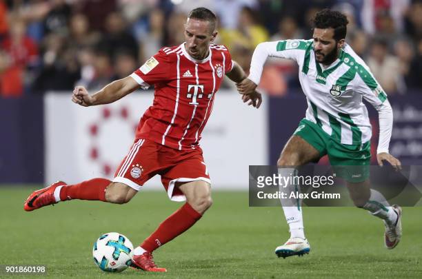 Franck Ribery of Muenchen is challenged by Ali Ahmed Qadri of Al Ahli during the friendly match between Al-Ahli and Bayern Muenchen on day 5 of the...