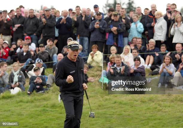 Peter Hedblom of Sweden celebrates after his final putt during the final round of the Johnnie Walker Championship on the PGA Centenary Course at...