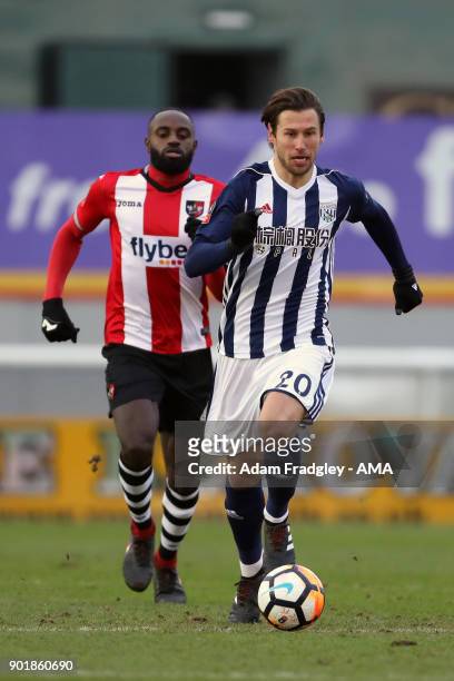 Lloyd James of Exeter City and Grzegorz Krychowiak of West Bromwich Albion during to the The Emirates FA Cup Third Round match between Exeter City v...