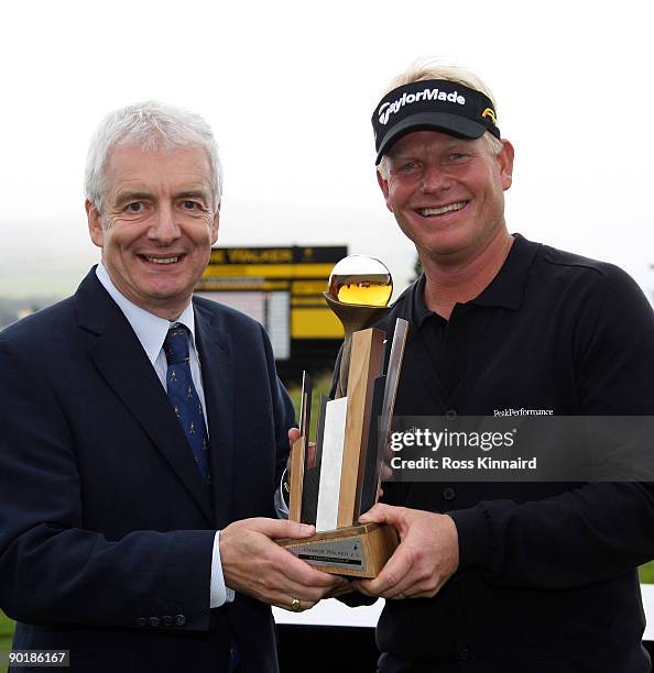 Peter Hedblom of Sweden is presented with the winners trophy by Peter Lederer, Chairman of Gleneagles after the final round of the Johnnie Walker...