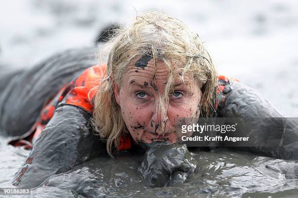 Participant pose after the football match during the Mudflat Olympic Games on August 30, 2009 in Brunsbuttel, Germany.