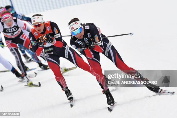 Norway's Heidi Weng competes followed by her compatriot Norway's Ingvild Flugstad Oestberg, on January 6, 2018 during the Women's Cross Country 10 km...