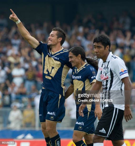 Dante Lopez of Pumas celebrates the first goal against Queretaro, with teammate Francisco Palencia during a football match of the Mexican Apertura...