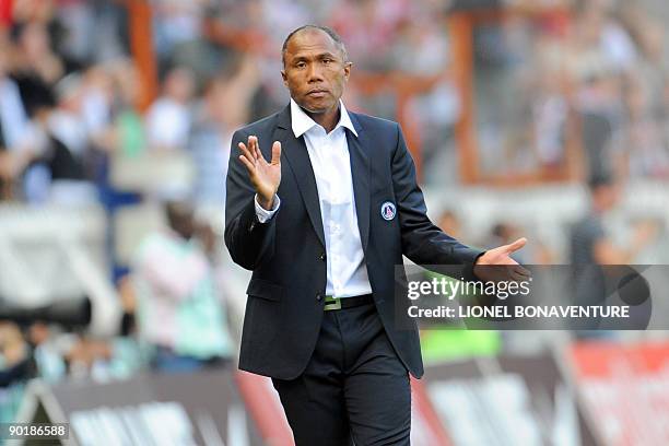 Paris coach Antoine Komouare celebrates after defender Christophe Jallet scored against Lille on August 30, 2009 during the French L1 football match...