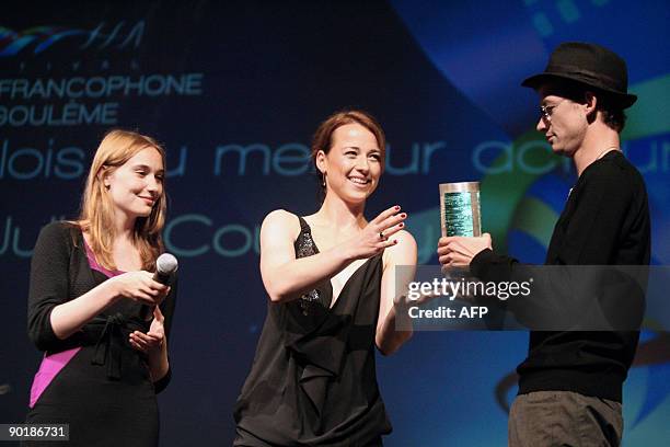 Belgium actress Deborah Francois and Quebec's actress Karine Vanasse give to French actor Julien Courbey an award, a Valois, after he winning in the...