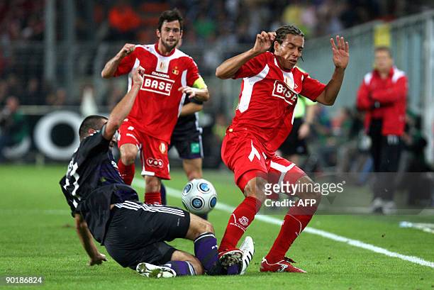 Standard's Axel Witsel gets a red card for this fault on Anderlecht's Marcin Wasilewski of Poland who left the field injured during the Belgian first...