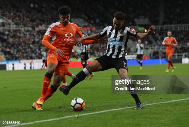 James Justin of Luton Town vies with Jacob Murphy of Newcastle United during the Emirates FA Cup third round match between Newcastle United and Luton...