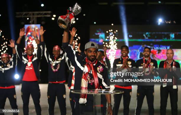 Omani football player Ahmed Mubarak holds the trophy of the 23th Gulf Cup of Nations 2017 during a celebration ceremony on January 6, 2018 after the...