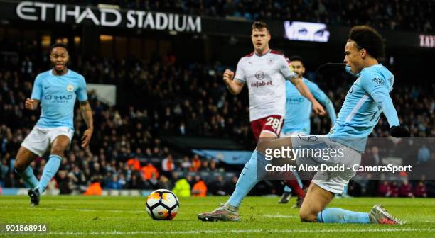 Manchester City's Leroy Sane scores his side's third goal during the Emirates FA Cup Third Round match between Manchester City and Burnley at Etihad...
