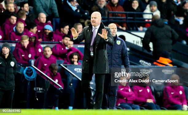 Burnley manager Sean Dyche shouts instructions to his team from the technical area during the Emirates FA Cup Third Round match between Manchester...