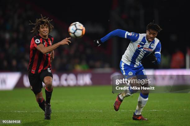 Nathan Ake of Bournemouth challenges Ivan Toney of Wigan during the The Emirates FA Cup Third Round match between AFC Bournemouth and Wigan Athletic...