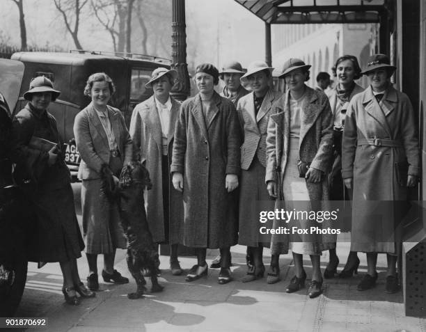 English golfers Pamela Barton and Doris Chambers accompany the American Ladies' Curtis Cup team as they leave the Savoy Hotel in London for a...