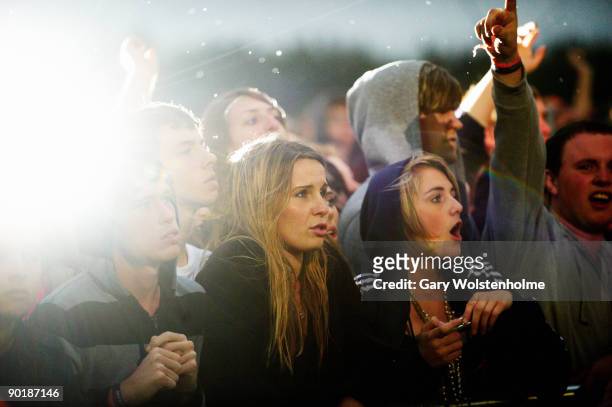 Music fans watch a performance on the last day of Leeds Festival at Bramham Park on August 30, 2009 in Leeds, England.