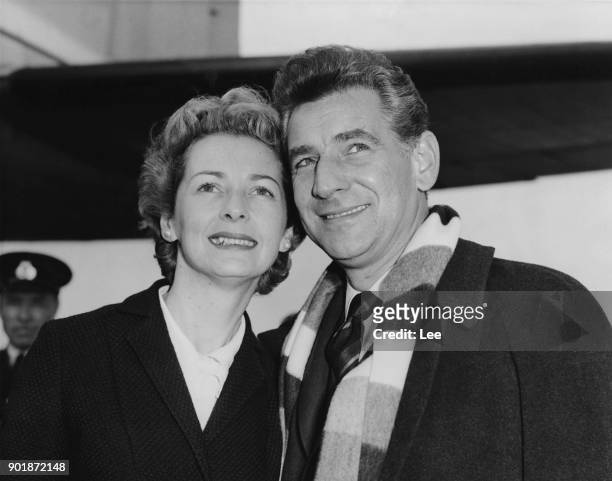 American composer Leonard Bernstein arrives at London Airport with his wife, actress Felicia Montealegre , having flown in from Gothenburg in Sweden,...