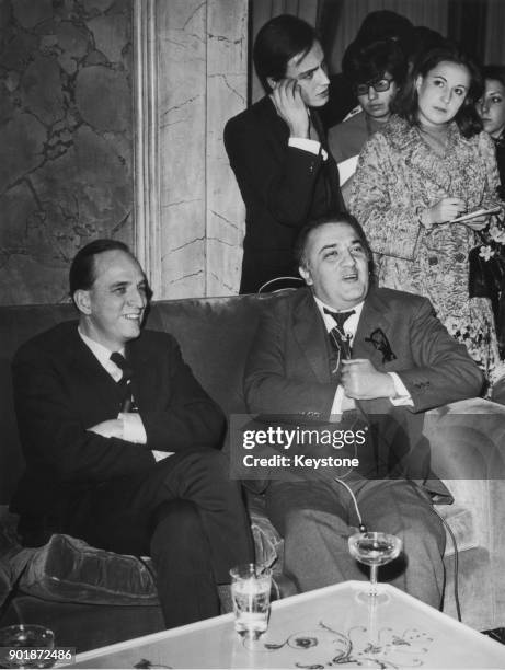 Swedish filmmaker Ingmar Bergman with Italian director Federico Fellini at a press conference in the Grand Hotel, Rome, circa 1969. The two planned a...