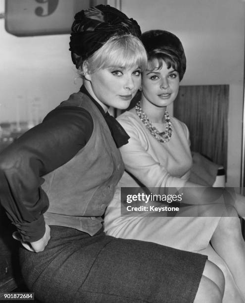 German actress Elke Sommer and Austrian actress Senta Berger arrive at London Airport, to make the film 'The Victors' at Shepperton Studios, 17th...