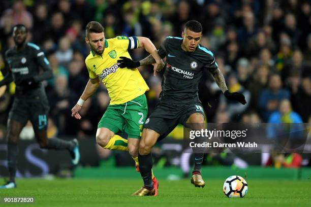 Kenedy of Chelsea is tackled by Ivo Pinto of Norwich City during The Emirates FA Cup Third Round match between Norwich City and Chelsea at Carrow...