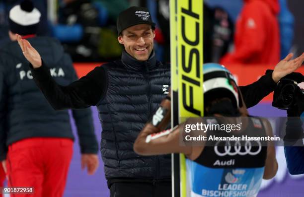 Former ski jumper Sven Hannawald of Germany congrats Kamil Stoch of Poland after the FIS Nordic World Cup Four Hills Tournament on January 6, 2018 in...