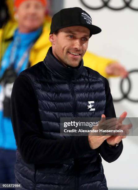 Former ski jumper Sven Hannawald of Germany congrats Kamil Stoch of Poland after the FIS Nordic World Cup Four Hills Tournament on January 6, 2018 in...