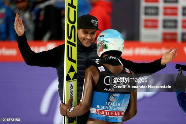 Former ski jumper Sven Hannawald of Germany congrats Kamil Stoch of Poland after the FIS Nordic World Cup Four Hills Tournament on January 6, 2018 in...