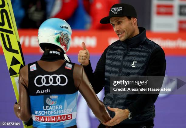 Former ski jumper Sven Hannawald of Germany congrats Kamil Stoch of Poland after the FIS Nordic World Cup Four Hills Tournament on January 6, 2018 in...