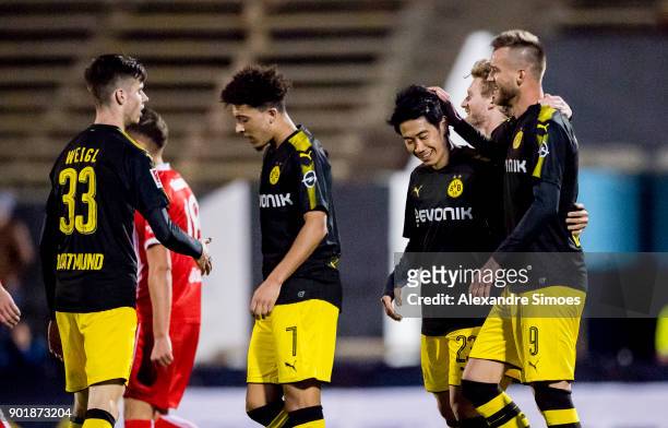 Shinji Kagawa of Borussia Dortmund celebrates scoring the goal to the 2:0 with his team mates during the friendly match between Borussia Dortmund and...